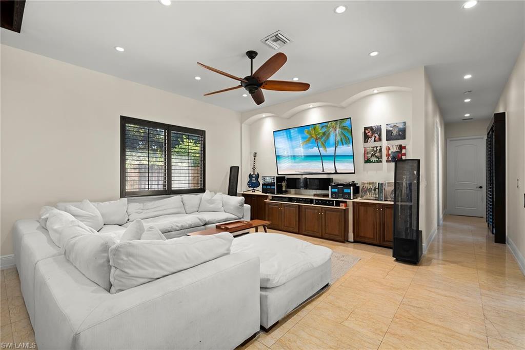 2605 64th Street Southwest Naples, FL 34105 - Photo 6 of 45 a living room with furniture and kitchen view