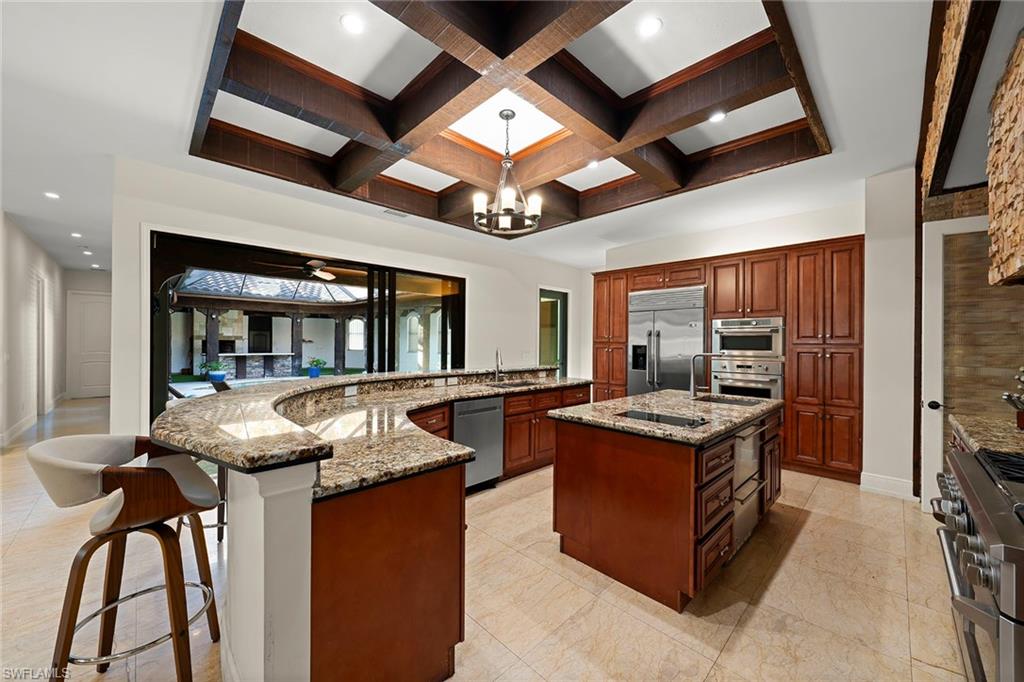 2605 64th Street Southwest Naples, FL 34105 - Photo 9 of 45 a kitchen with granite countertop lots of counter top space