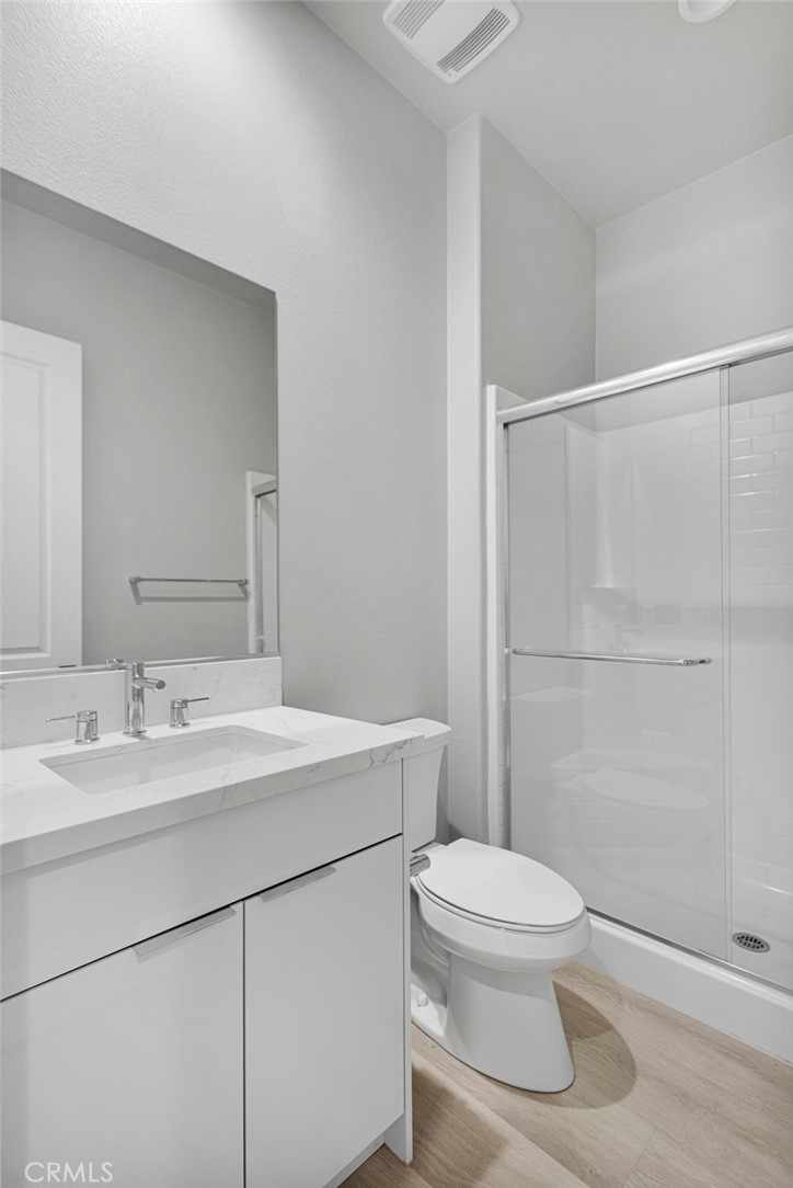 12925 Davona Dale Road Apple Valley, CA 92308 - Photo 23 of 44 a bathroom with a sink a toilet and shower