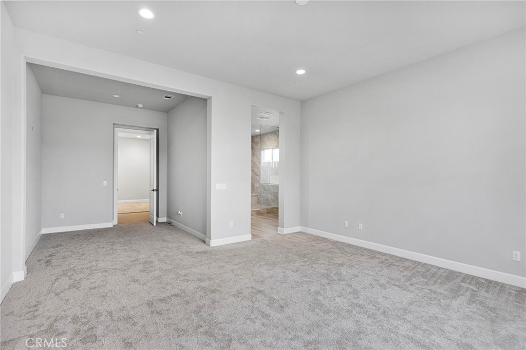 12925 Davona Dale Road Apple Valley, CA 92308 - Photo 29 of 44 an empty room with closet and a bathroom