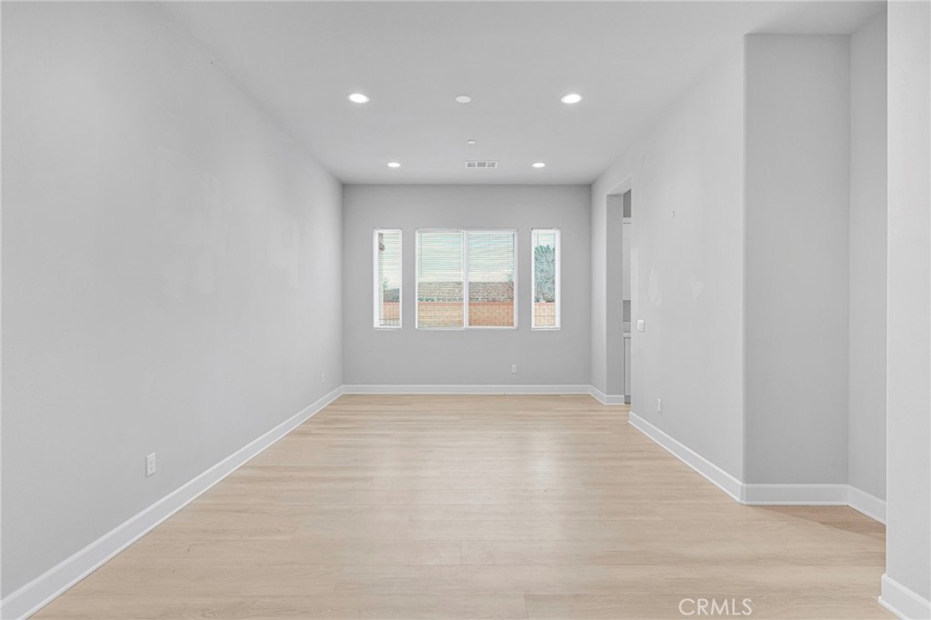 12925 Davona Dale Road Apple Valley, CA 92308 - Photo 4 of 44 an empty room with windows and closet