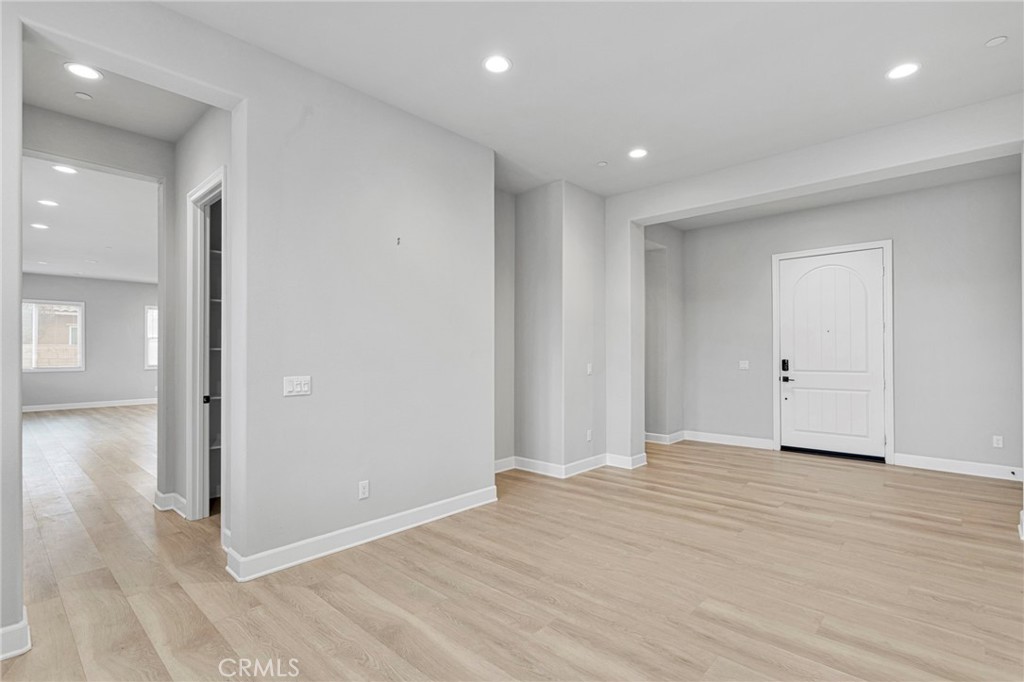 12925 Davona Dale Road Apple Valley, CA 92308 - Photo 6 of 44 a view of a livingroom with wooden floor