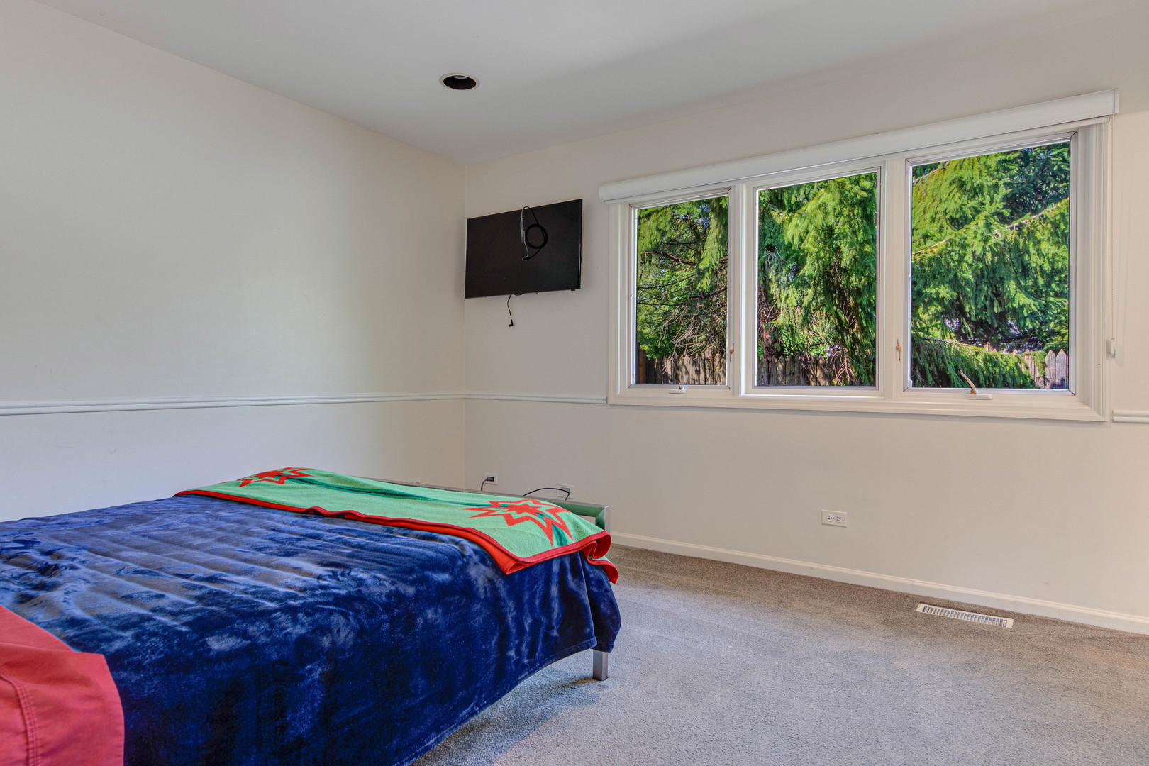 1144 Mayfair Lane Glencoe, IL 60022 - Photo 13 of 23 a bedroom with a bed and a flat tv screen on dresser