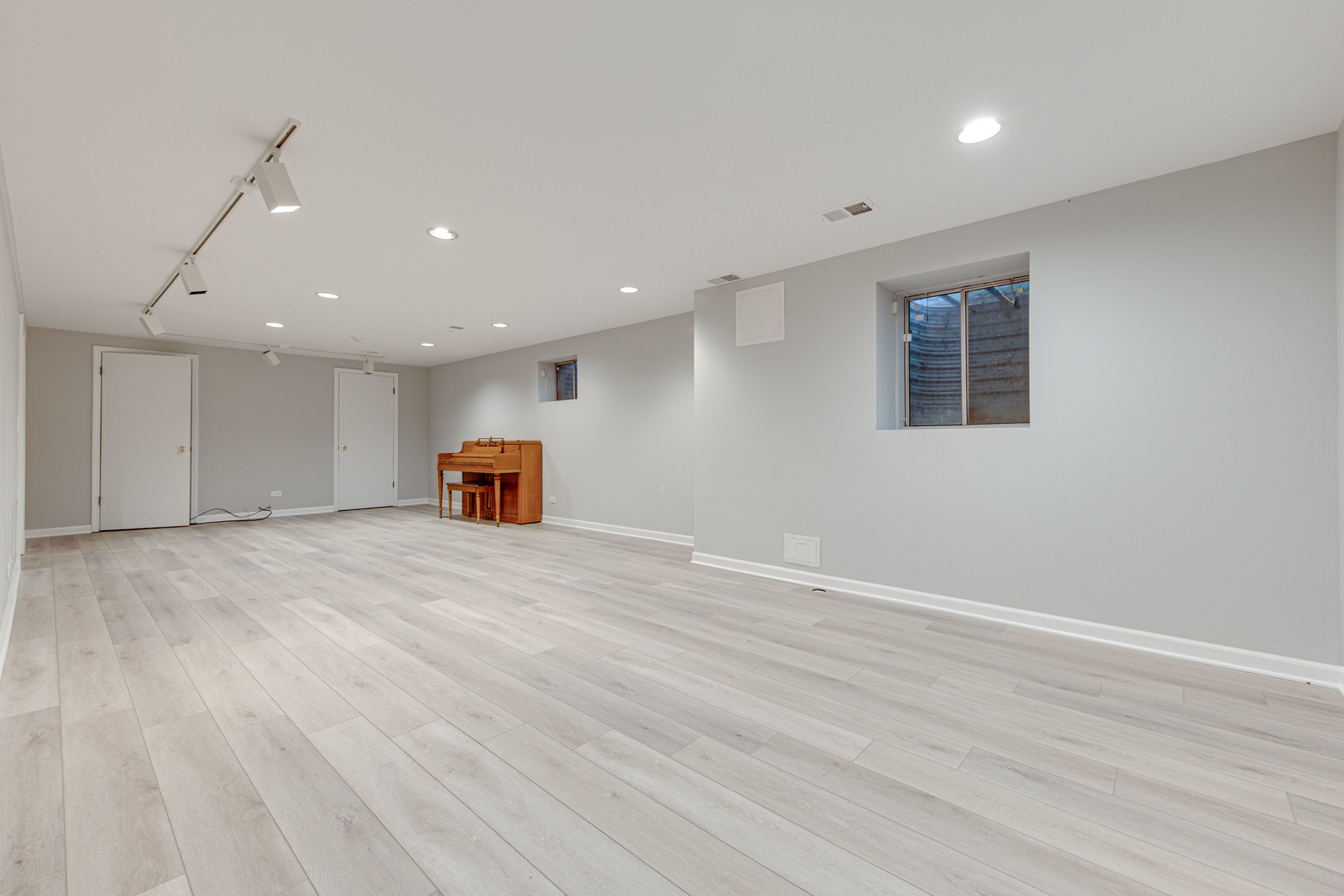 1144 Mayfair Lane Glencoe, IL 60022 - Photo 19 of 23 a big room with wooden floor and a window