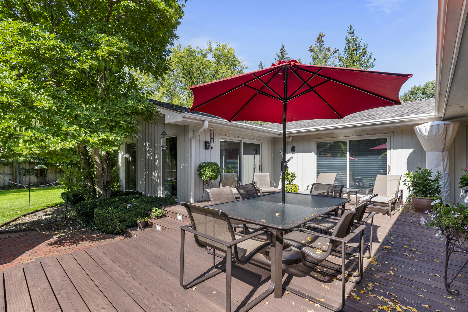 1144 Mayfair Lane Glencoe, IL 60022 - Photo 21 of 23 a view of a house with backyard sitting area and garden