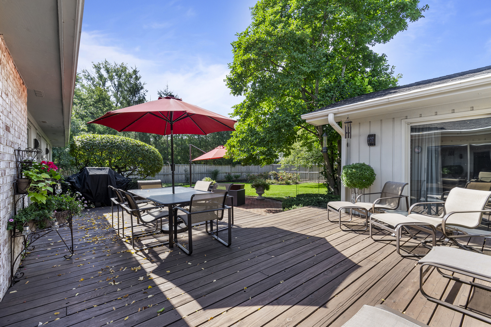 1144 Mayfair Lane Glencoe, IL 60022 - Photo 22 of 23 a view of a house with wooden deck and furniture