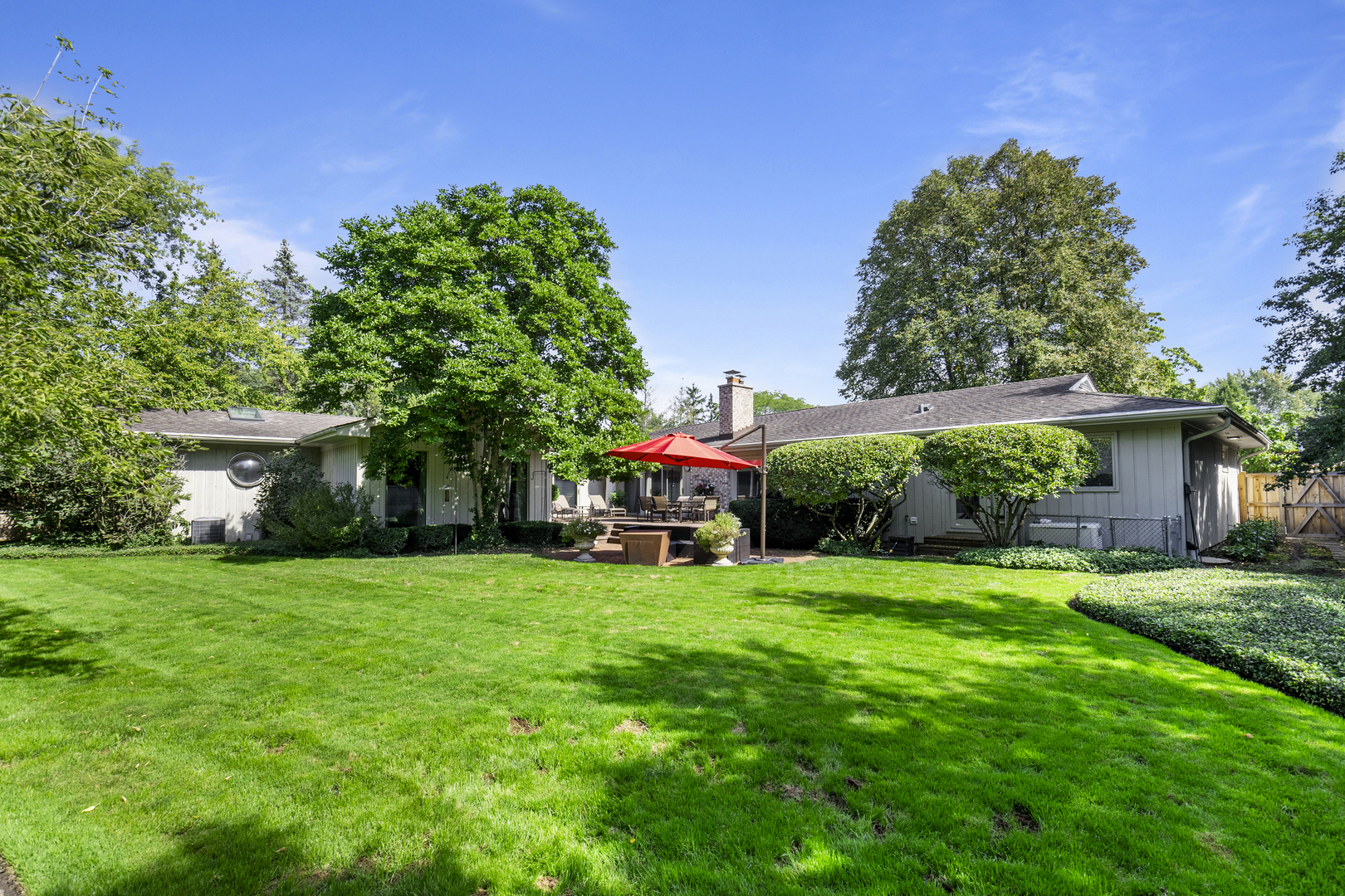 1144 Mayfair Lane Glencoe, IL 60022 - Photo 23 of 23 a view of a house with a yard and sitting area