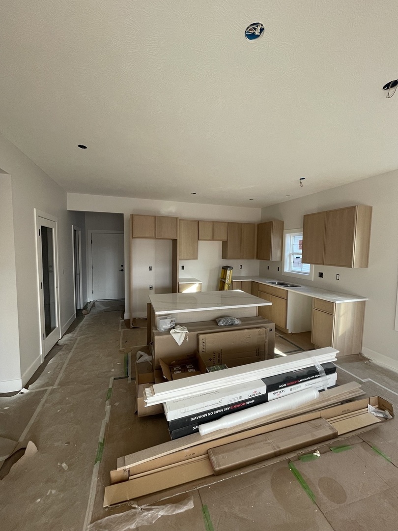 1525 Belclare Road Normal, IL 61761 - Photo 3 of 10 a living room with stainless steel appliances furniture and a kitchen view
