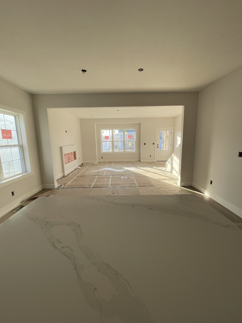 1525 Belclare Road Normal, IL 61761 - Photo 4 of 10 a view of an empty room with a window