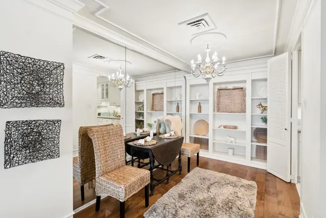 a kitchen with stainless steel appliances granite countertop a sink a stove and cabinets
