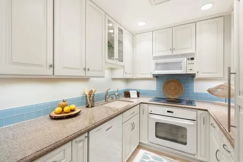 a spacious bedroom with two beds and a couch