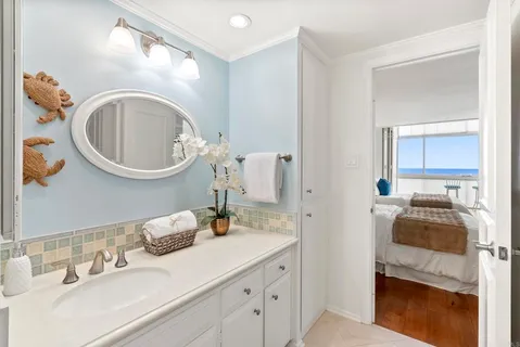 a bathroom with a sink a vanity and a mirror