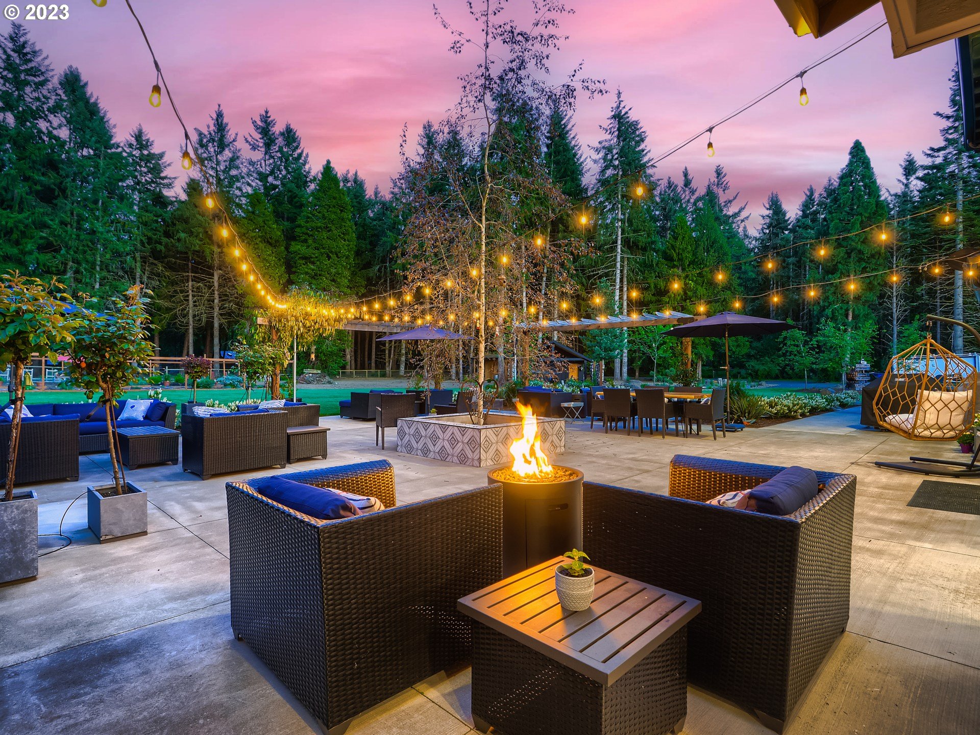 15631 Northeast Becke Road Aurora, OR 97002 - Photo 38 of 47 a view of a patio with couches and a fire pit and a fire pit