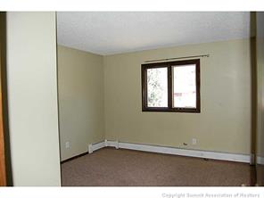 172 Alpine Road Dillon, CO 80435 - Photo 9 of 18 an empty room with wooden floor and windows