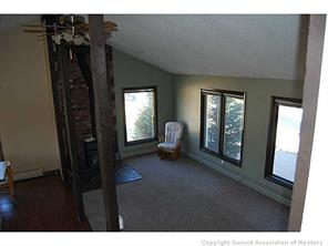 172 Alpine Road Dillon, CO 80435 - Photo 10 of 18 a view of hallway with furniture and a window