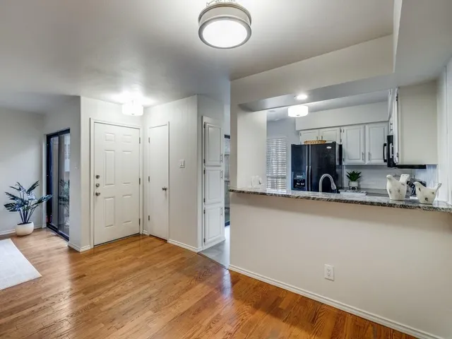 a view of kitchen with wooden floor