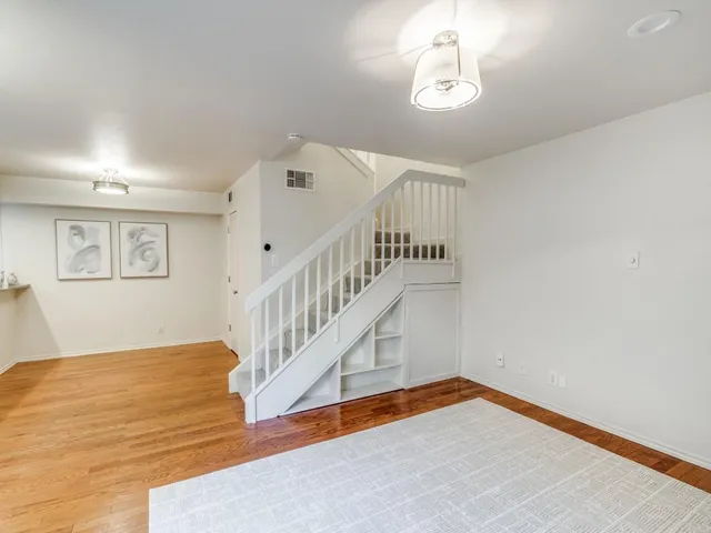 a view of an entryway with wooden floor