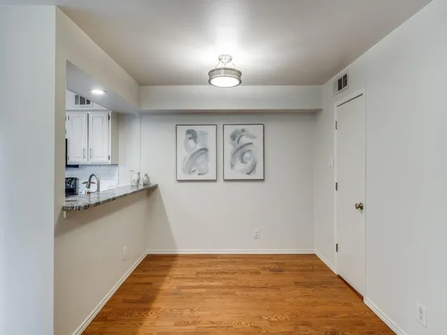 a view of a kitchen with a sink and dishwasher