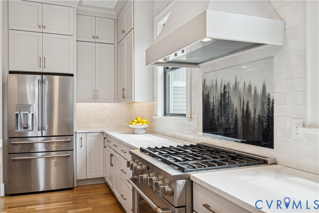 1551 Smokey Rdg Road Maidens, VA 23102 - Photo 12 of 49 a kitchen with stainless steel appliances a stove a refrigerator and cabinets