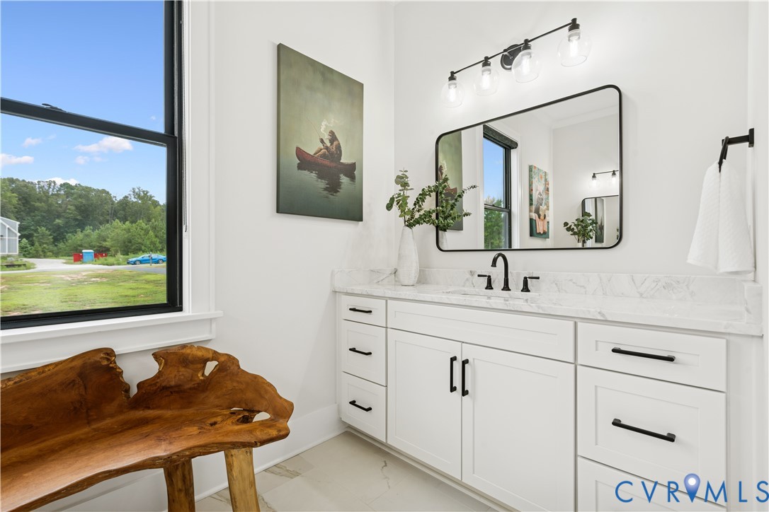 1551 Smokey Rdg Road Maidens, VA 23102 - Photo 22 of 49 a en suite bathroom with a double vanity sink and a mirror