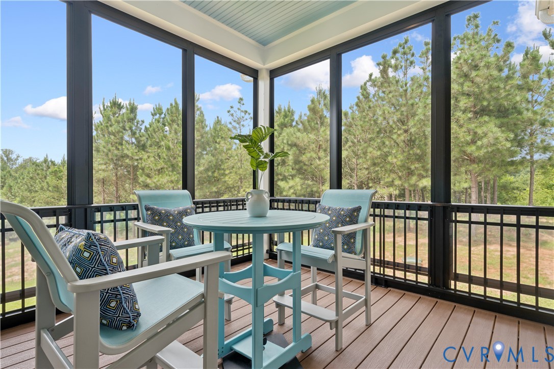 1551 Smokey Rdg Road Maidens, VA 23102 - Photo 24 of 49 a view of a balcony with chairs and wooden floor