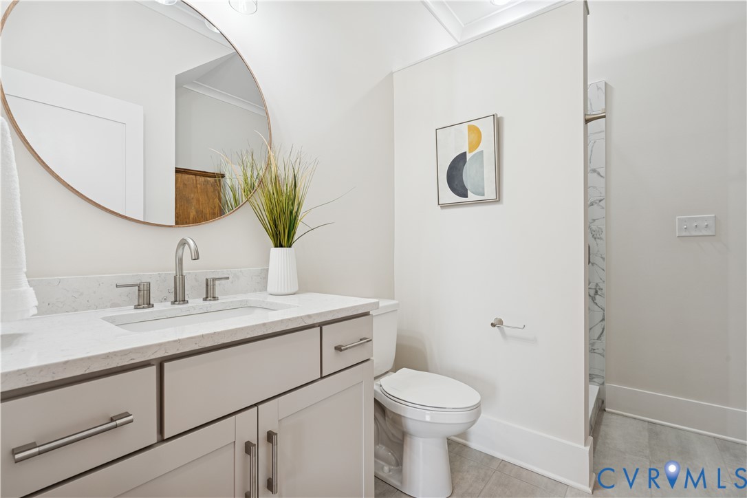 1551 Smokey Rdg Road Maidens, VA 23102 - Photo 26 of 49 a bathroom with a toilet sink and mirror