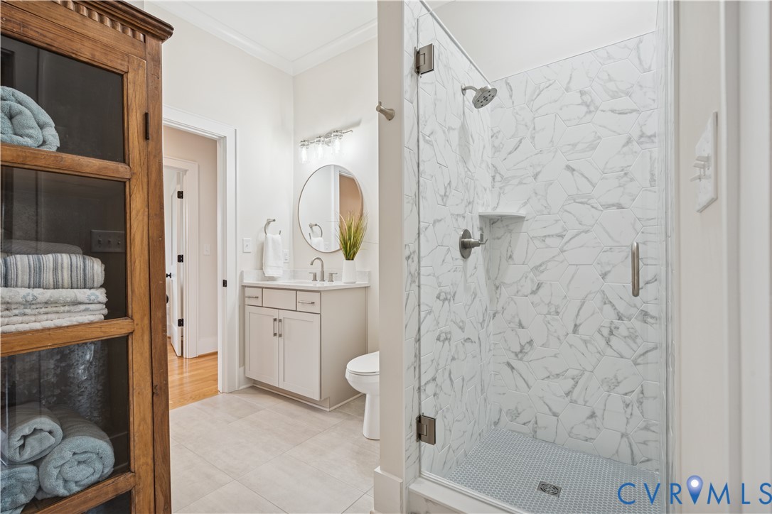 1551 Smokey Rdg Road Maidens, VA 23102 - Photo 27 of 49 a bathroom with a granite countertop sink a toilet and shower