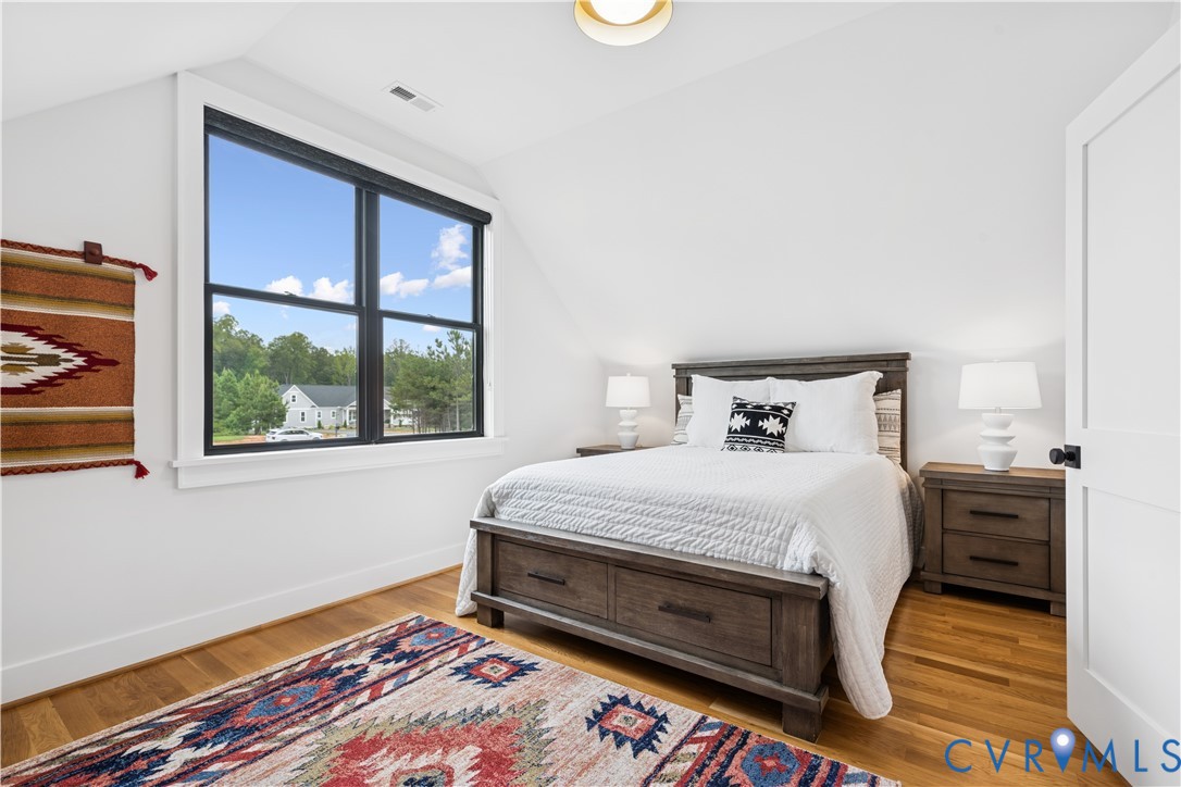 1551 Smokey Rdg Road Maidens, VA 23102 - Photo 31 of 49 a bed sitting in a bedroom next to a window