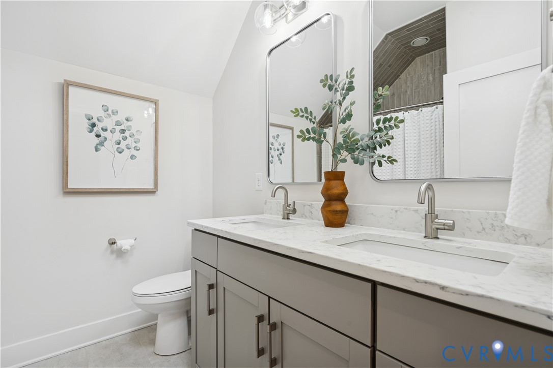 1551 Smokey Rdg Road Maidens, VA 23102 - Photo 33 of 49 a bathroom with a toilet sink and mirror
