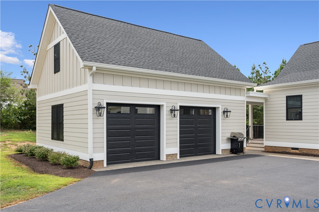 1551 Smokey Rdg Road Maidens, VA 23102 - Photo 39 of 49 a front view of a house with a yard and garage