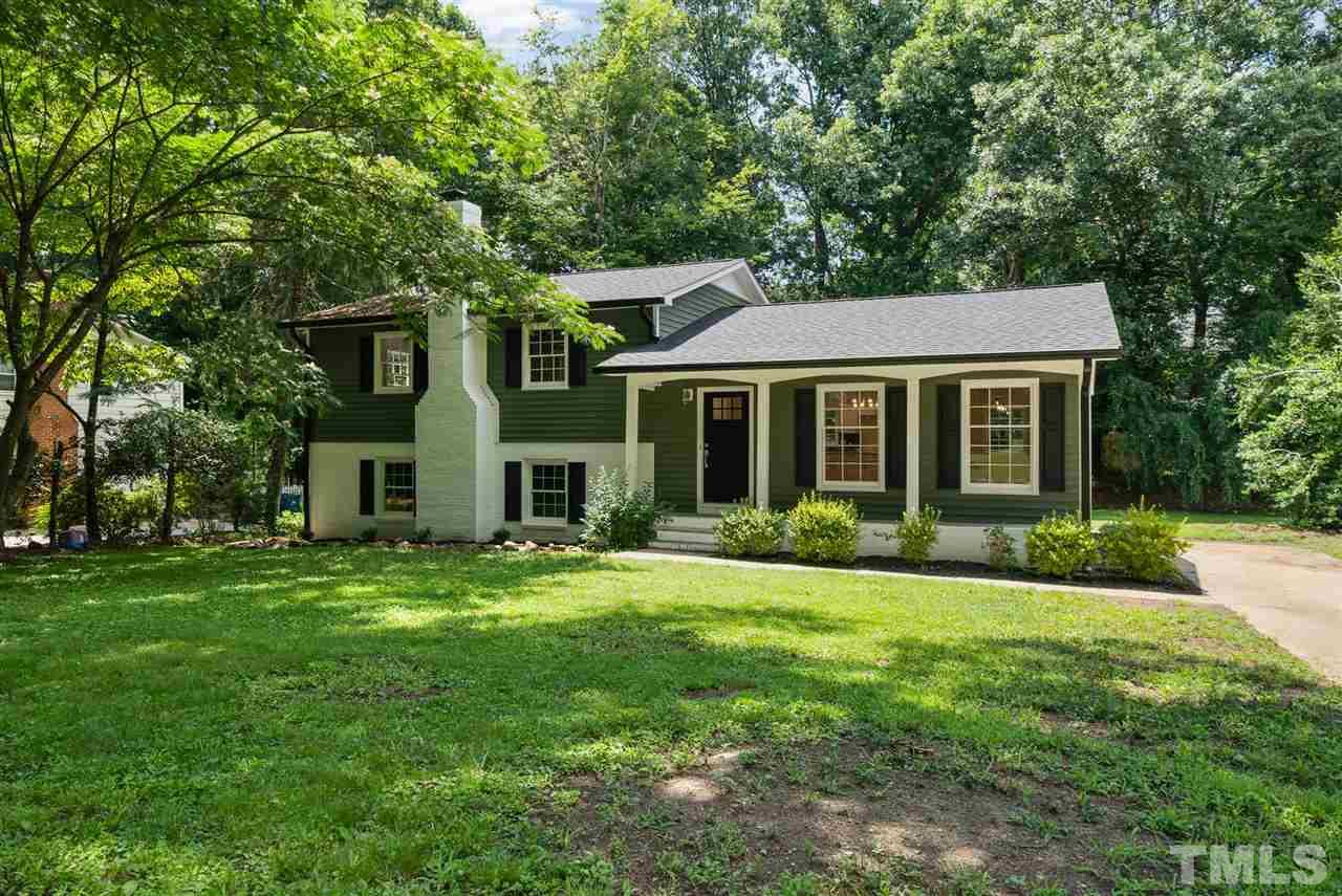 7409 Fiesta Way Raleigh, NC 27615 - Photo 2 of 30 a front view of house with yard and green space