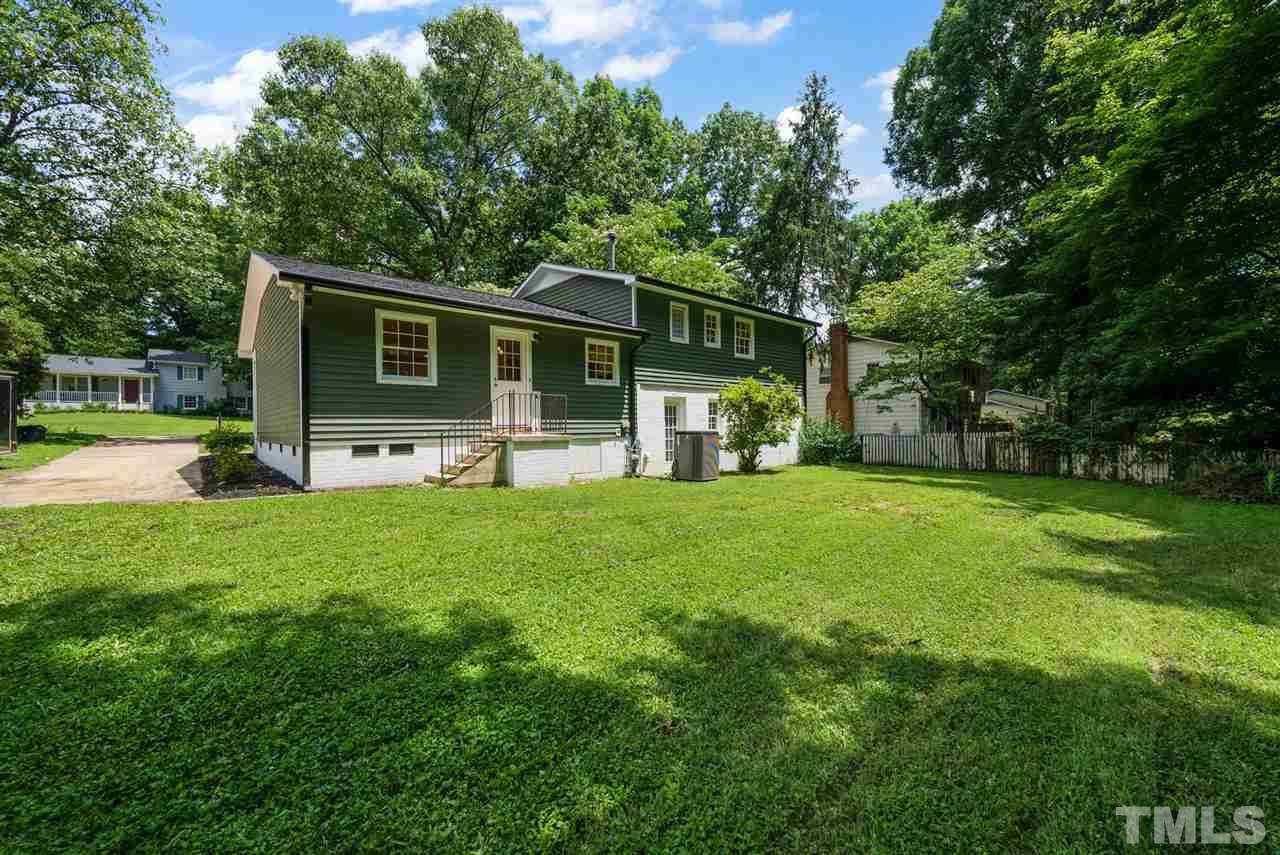 7409 Fiesta Way Raleigh, NC 27615 - Photo 29 of 30 a front view of house with yard and trees