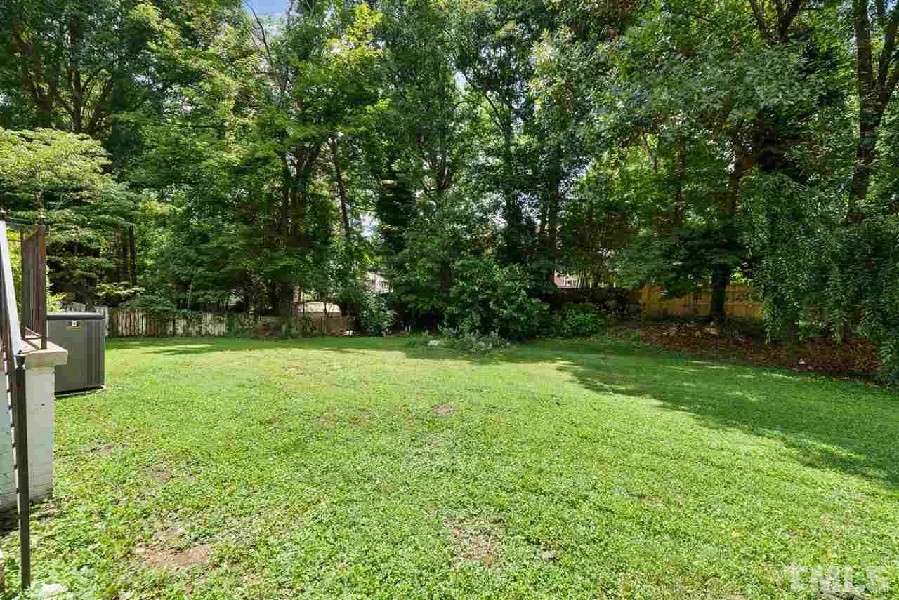 7409 Fiesta Way Raleigh, NC 27615 - Photo 30 of 30 a view of a yard with a tree