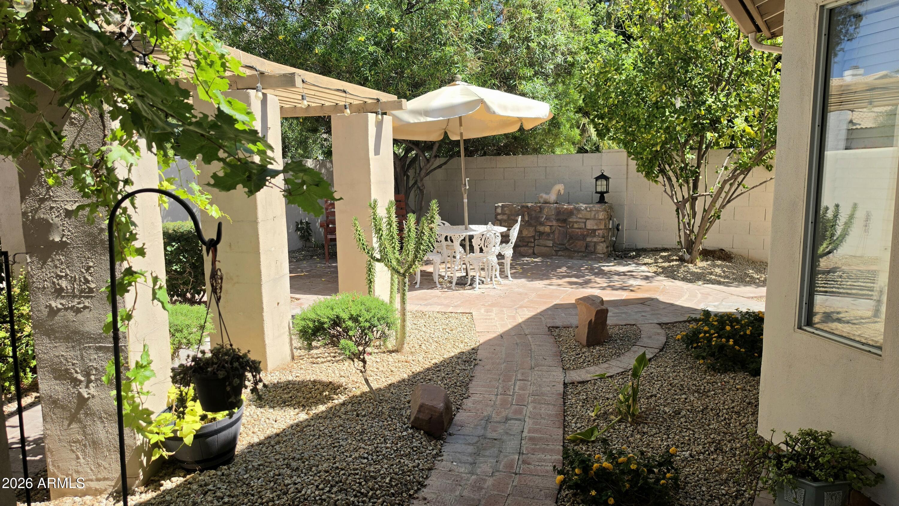 2214 East Beachcomber Drive Gilbert, AZ 85234 - Photo 27 of 45 Backyard white table