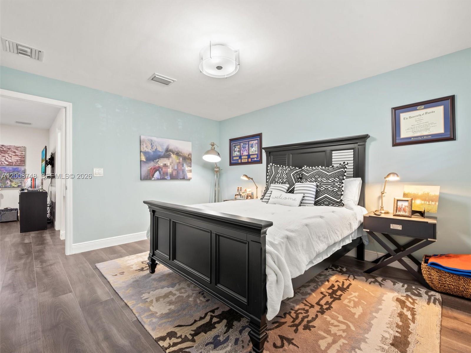 8889 Southwest 78th Court Miami, FL 33156 - Photo 13 of 23 a bed room with a bed and a television