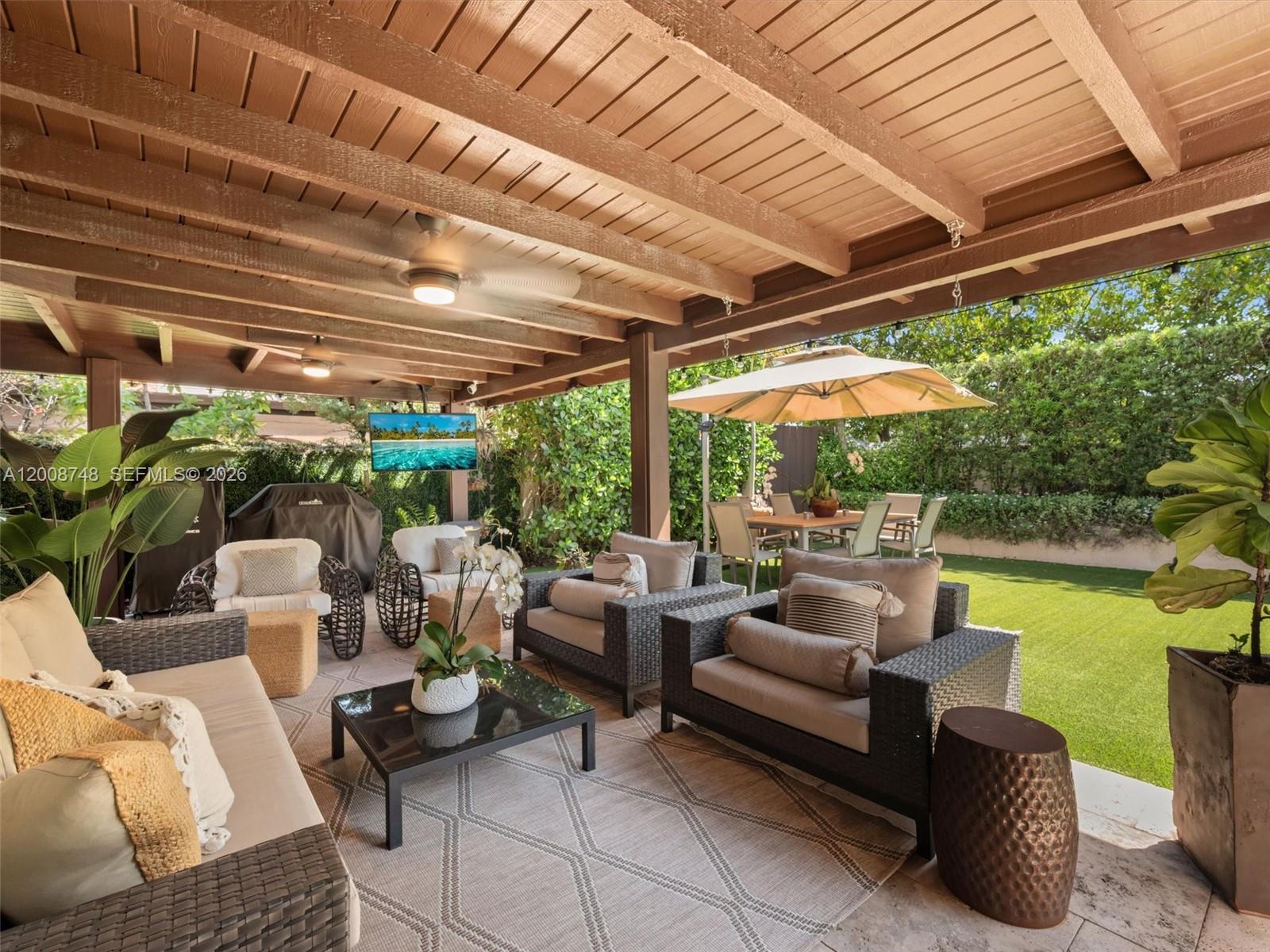 8889 Southwest 78th Court Miami, FL 33156 - Photo 20 of 23 a outdoor living space with furniture and garden view