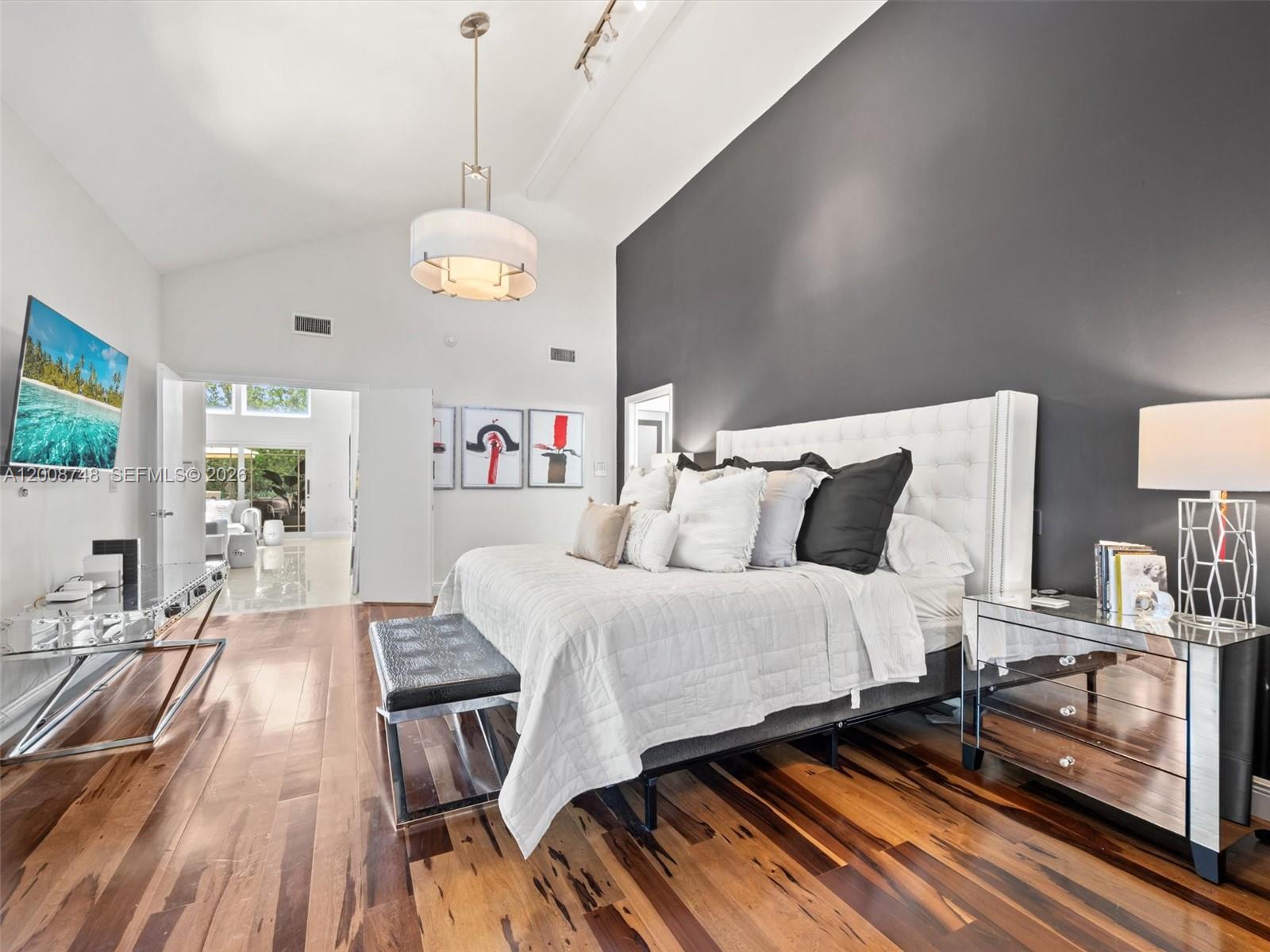 8889 Southwest 78th Court Miami, FL 33156 - Photo 10 of 23 a bedroom with bed and wooden floor