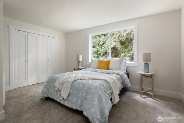 a bedroom with a bed and window