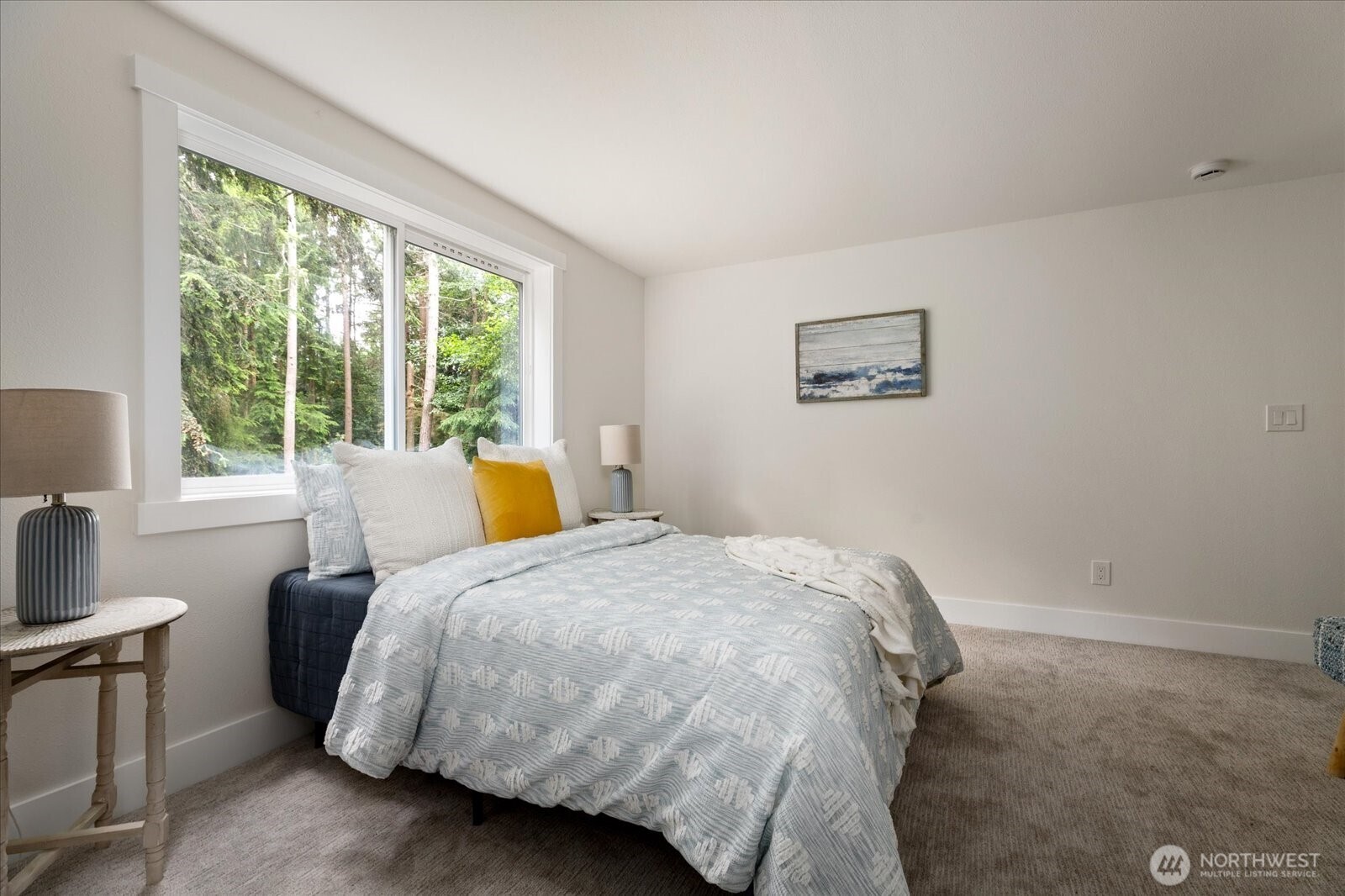 8038 Island Court Clinton, WA 98236 - Photo 16 of 23 a bedroom with a bed and a large window