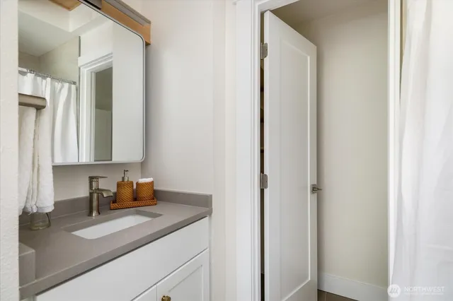 a bathroom with a sink and a mirror