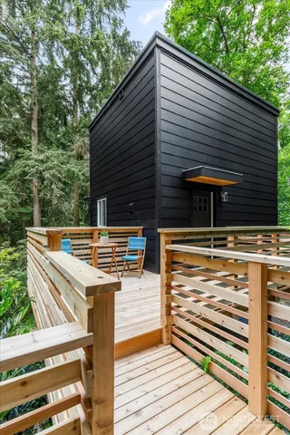 a view of a patio with two chairs and a table