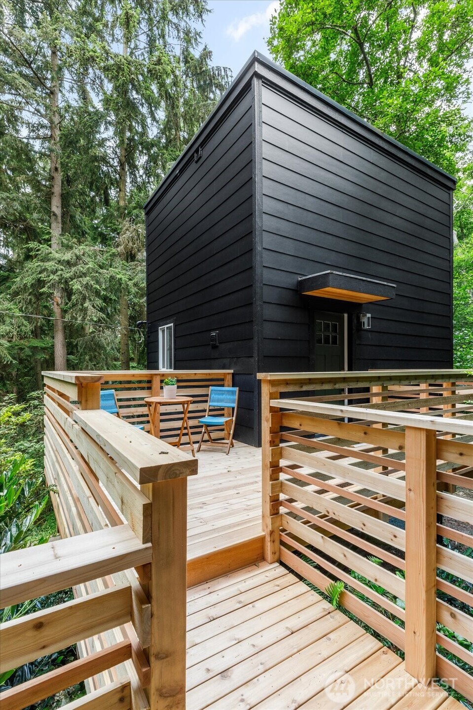 8038 Island Court Clinton, WA 98236 - Photo 2 of 23 a view of a patio with two chairs and a table