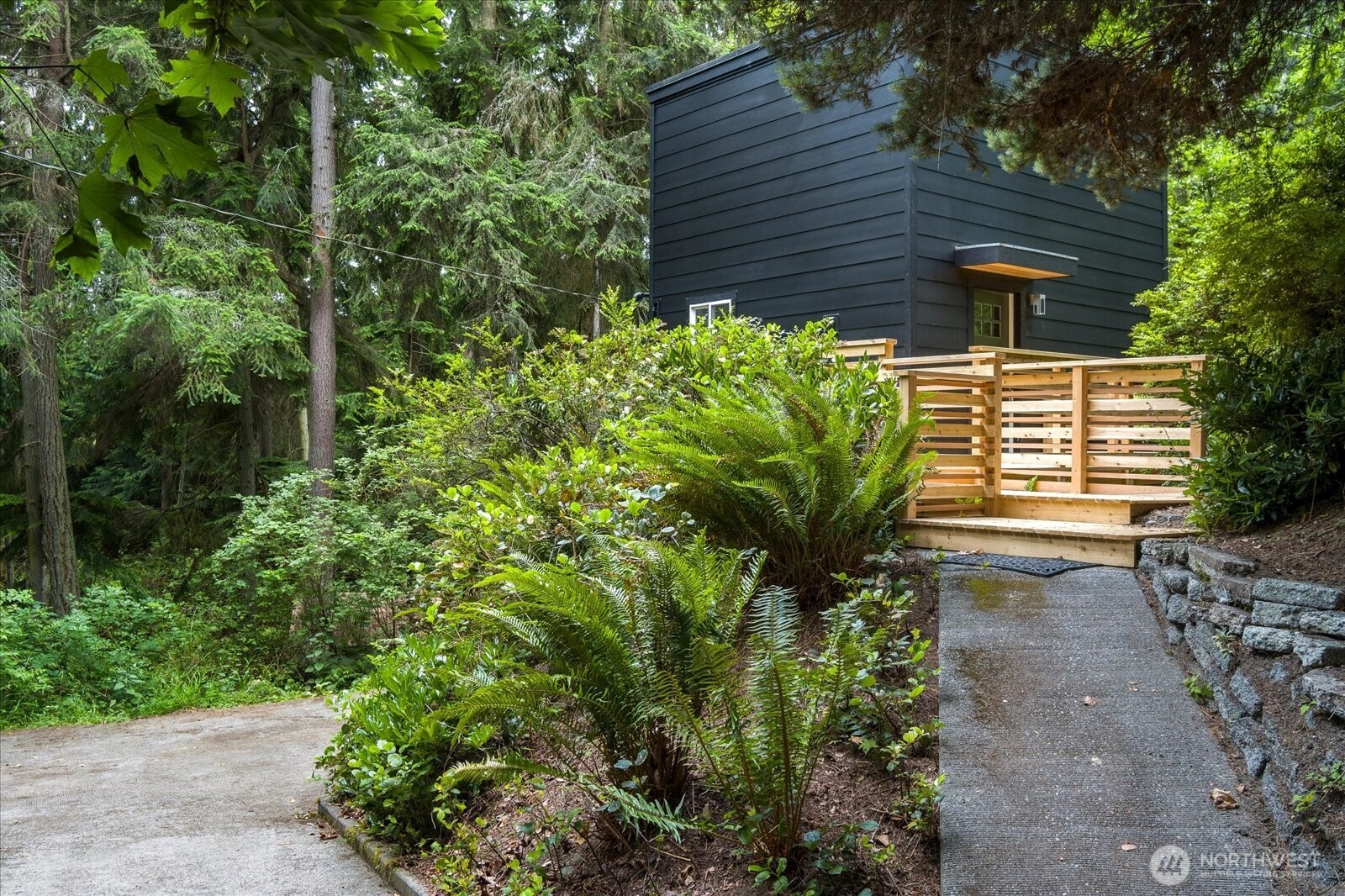 8038 Island Court Clinton, WA 98236 - Photo 4 of 23 a view of a backyard with plants