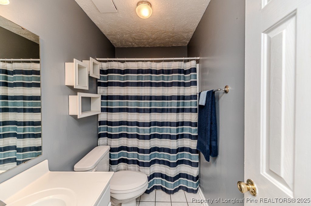 3508 Talus Road Fayetteville, NC 28306 - Photo 39 of 47 a bathroom with a sink toilet and shower