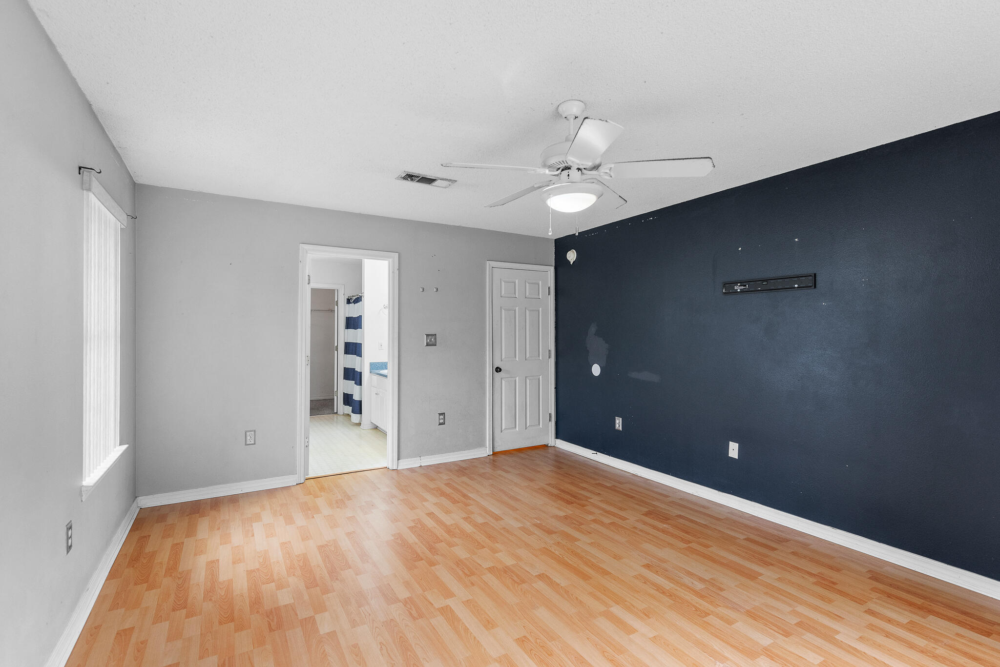 2246 Titanium Drive Crestview, FL 32536 - Photo 15 of 28 a view of a big room with closet and chandelier fan