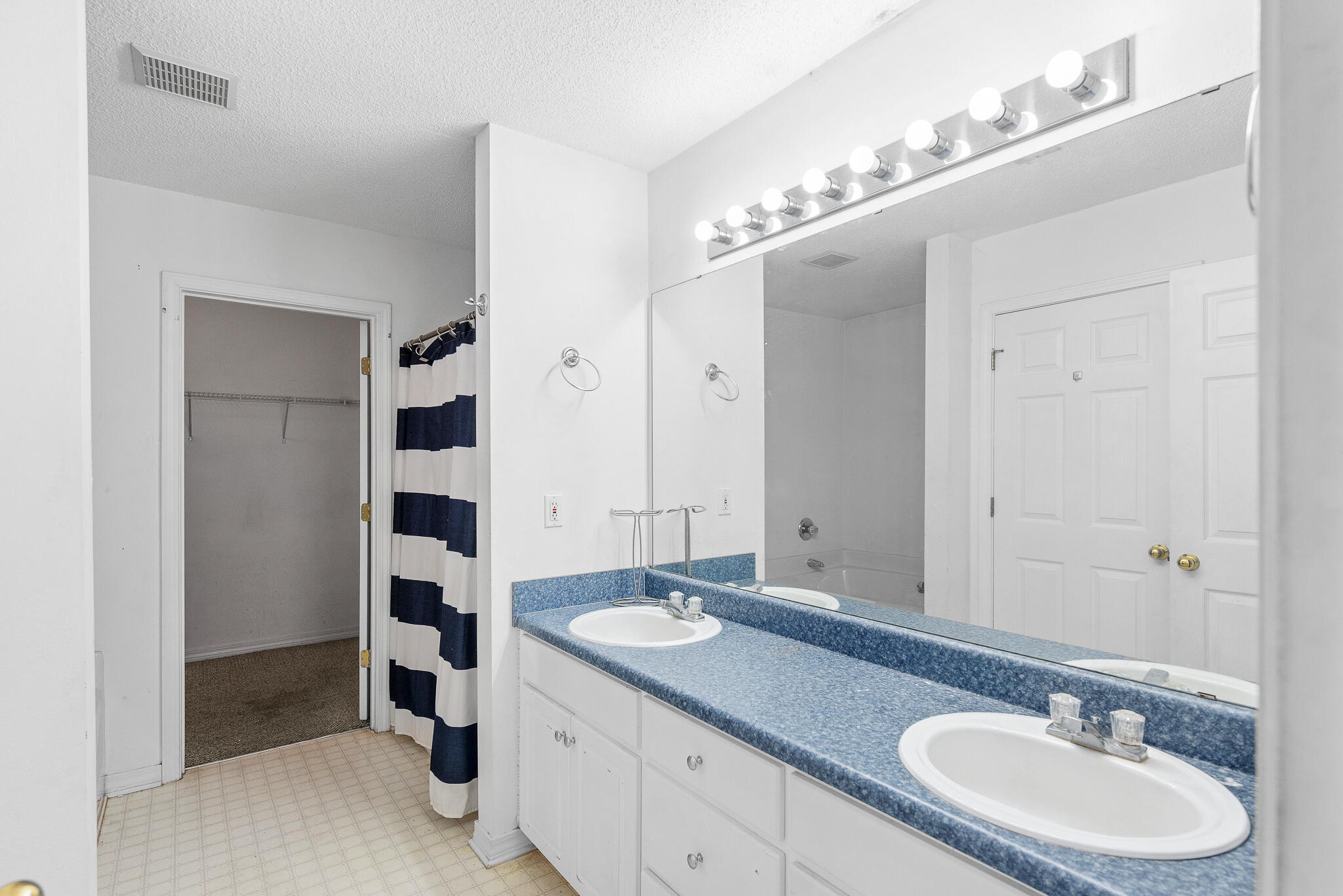 2246 Titanium Drive Crestview, FL 32536 - Photo 16 of 28 a bathroom with a sink double vanity and a mirror