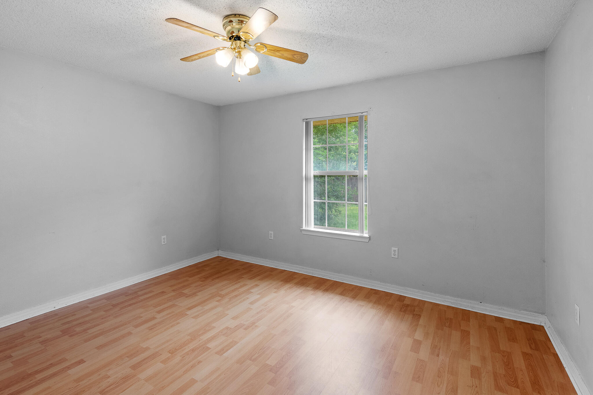 2246 Titanium Drive Crestview, FL 32536 - Photo 25 of 28 an empty room with a window and a fan