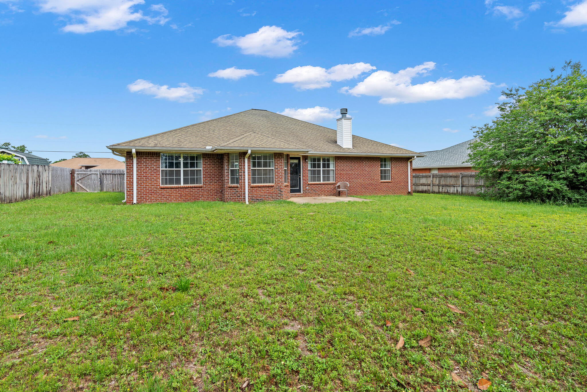 2246 Titanium Drive Crestview, FL 32536 - Photo 26 of 28 a view of a house with a big yard
