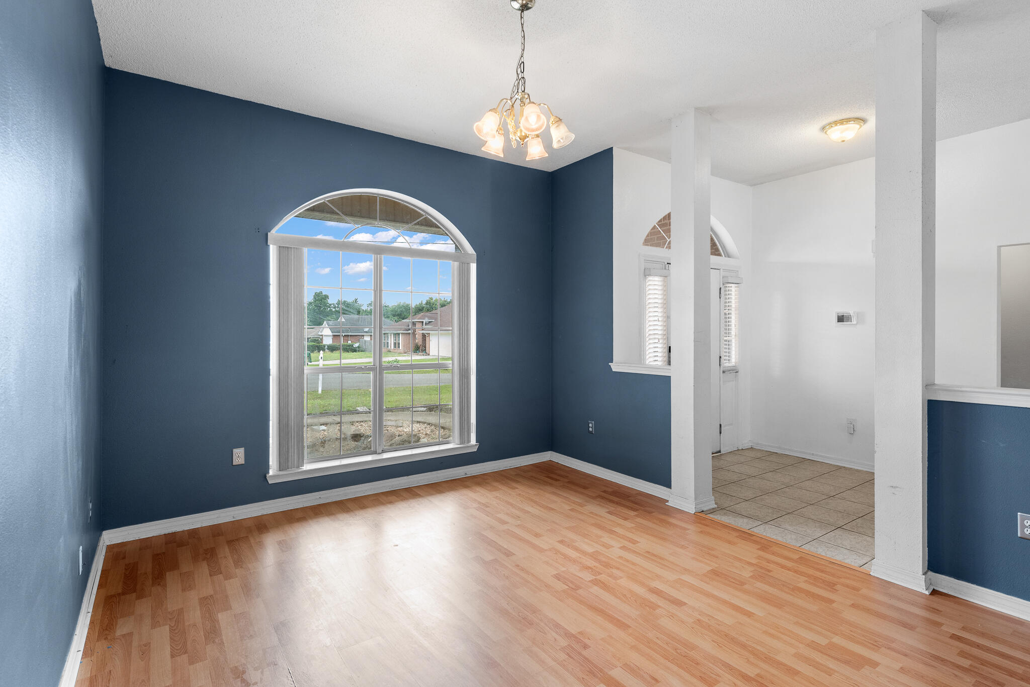 2246 Titanium Drive Crestview, FL 32536 - Photo 3 of 28 a view of a room with window wooden floor and brick walls