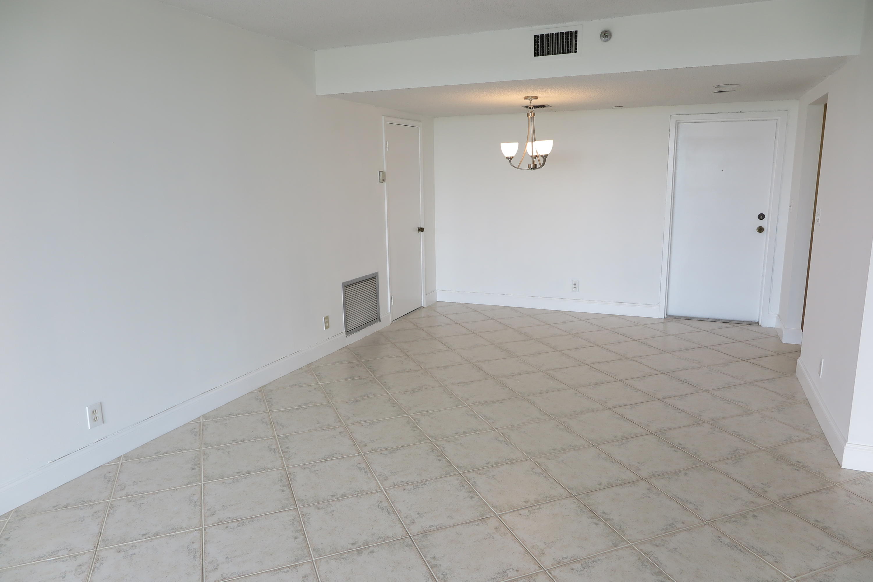 5951 Wellesley Park Drive, Unit 601 Boca Raton, FL 33433 - Photo 2 of 21 living room and dining room